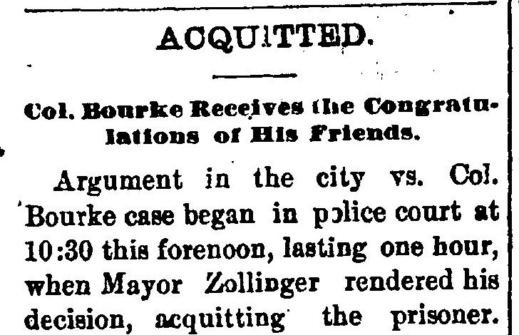 A newspaper column headed ACQUITTED, with a smaller line beneath reading Col. Bourke Receives the Congratulations of His Friends, and the opening paragraph saying argument began in police court at 10:30 this forenoon, lasting one hour, when Mayor Zollinger rendered his decision, acquitting the prisoner.